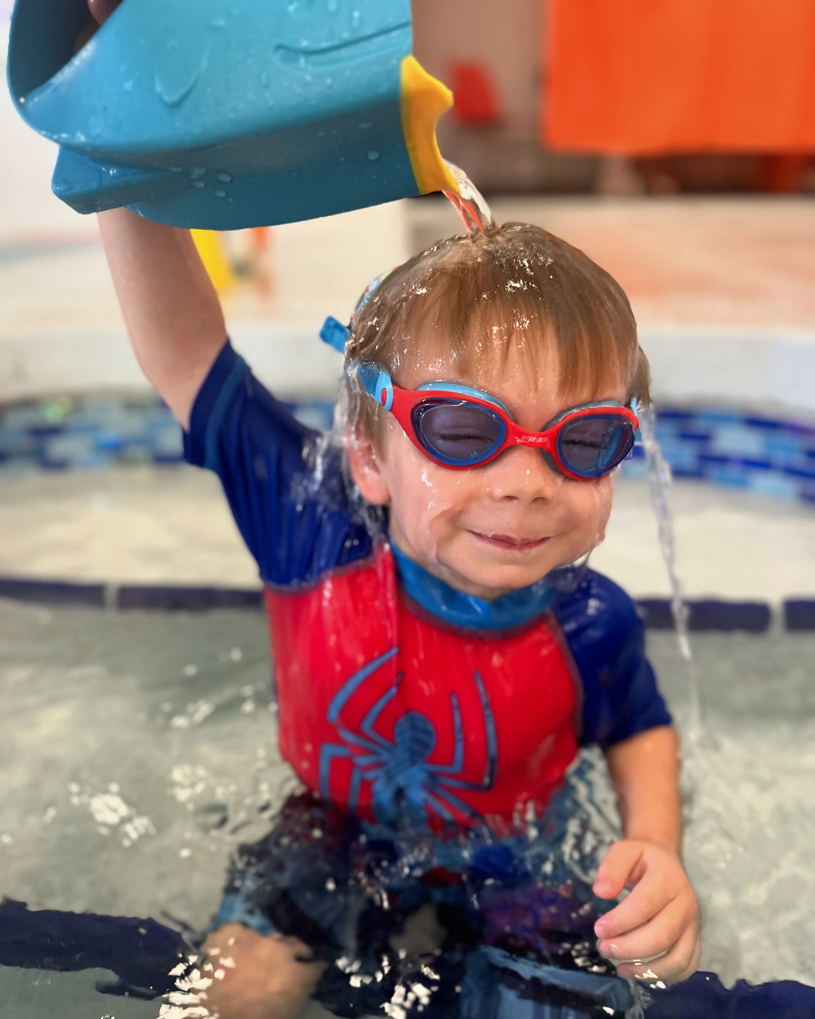 happy childrens group at swimming pool class learning to swim