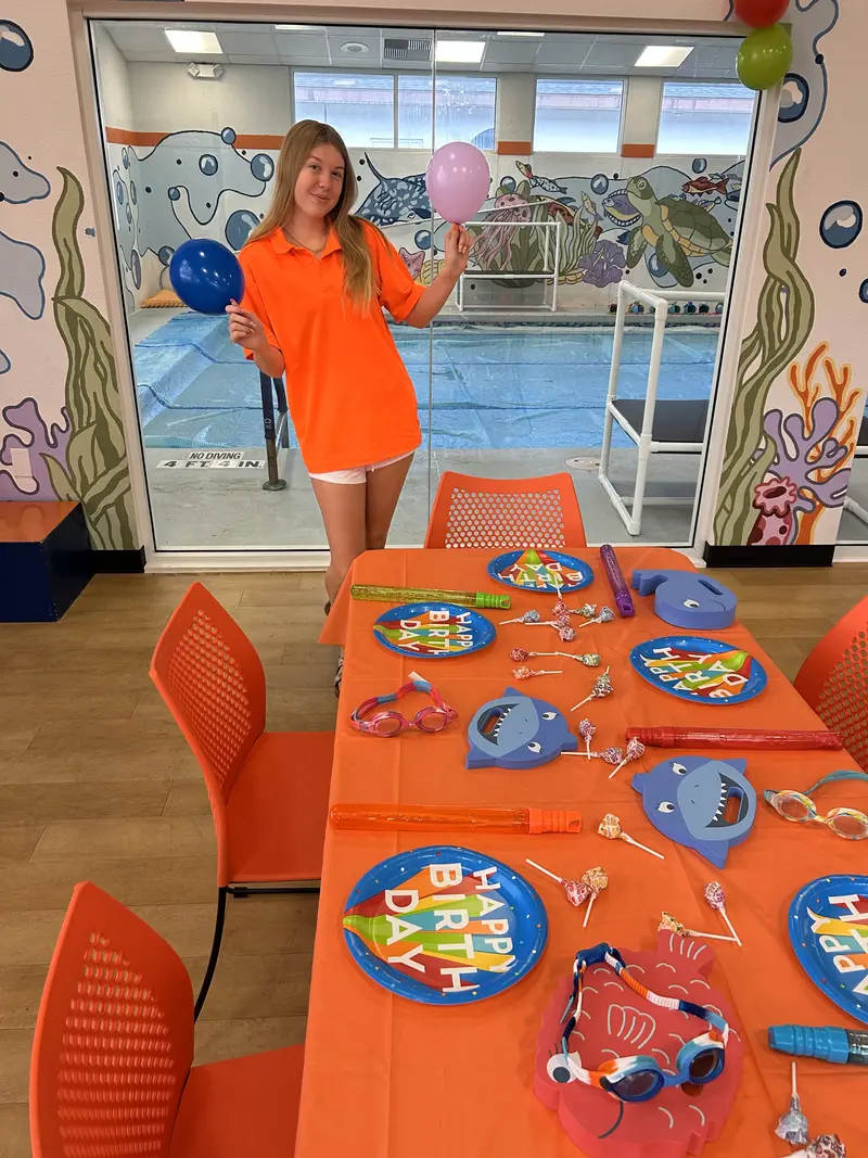 Birthday party set up in a rec room at Fintastic Swim Academy