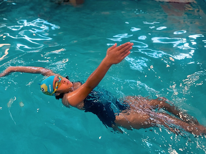Swimmer doing the backstroke at Fintastic